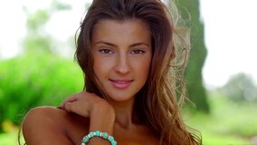 A slim sexy chick with a sexy butt is massaging her wet pussy lips